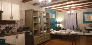 a kitchen with a large cabinet with a bed in it at Zagroda AlpakoTerapii in Świeradów-Zdrój