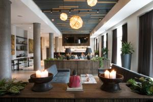 a lobby with a table with candles on it at Fosshotel Reykjavík in Reykjavík