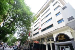 a large white building on a city street at Özdemir Palas in Ankara