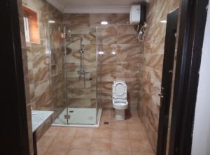 A bathroom at Msquare Hotel GRA