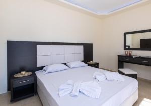 Кровать или кровати в номере Villa Antonis deluxe apartments