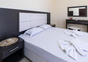Кровать или кровати в номере Villa Antonis deluxe apartments