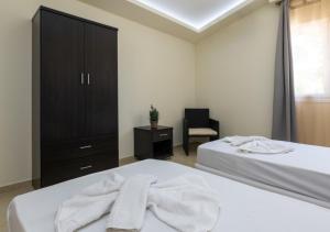 Кровать или кровати в номере Villa Antonis deluxe apartments