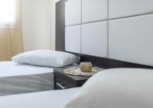 Кровать или кровати в номере Villa Antonis deluxe apartments