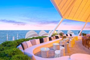 a view of the ocean from the deck of a resort at Paloma Foresta in Beldibi