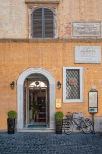 a bicycle parked in front of a building at Antico Albergo del Sole al Pantheon in Rome