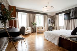 Postel nebo postele na pokoji v ubytování Centric Hotel