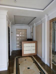 a hallway with a dresser in a room at Odessa Pearl Apartment in Odesa