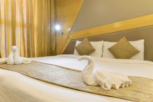 Ένα ή περισσότερα κρεβάτια σε δωμάτιο στο Dragonfly Hotel - The Art Hotel