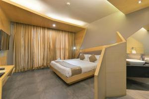 Ένα ή περισσότερα κρεβάτια σε δωμάτιο στο Dragonfly Hotel - The Art Hotel