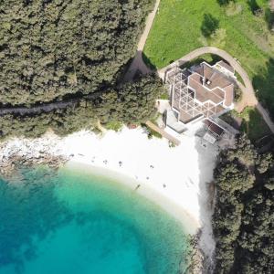 an aerial view of a house next to a beach at RAINBOW in Pula