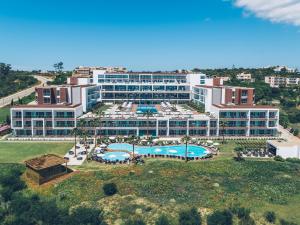an aerial view of a resort with a pool at Iberostar Selection Lagos Algarve in Lagos