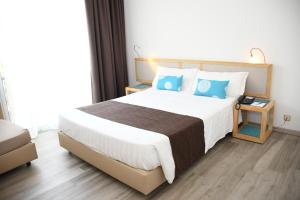 Voodi või voodid majutusasutuse Baia di Conte Resort toas