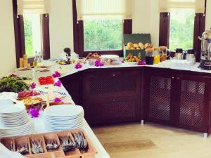 a table with plates of food on top of it at Nehir Dalyan Boutique Otel in Ortaca