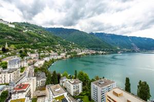 an aerial view of a city next to a river at Montreux & Leman View Apartment in Montreux