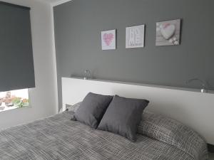 Łóżko lub łóżka w pokoju w obiekcie Vivienda Aries