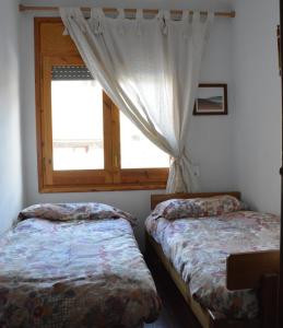 A bed or beds in a room at La rotonda de Llívia