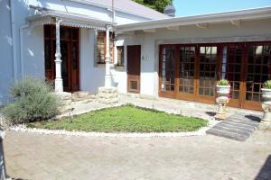 a house with a garden in front of it at The Well guesthouse/Retreat in Kroonstad