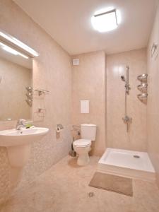 a bathroom with a sink and a toilet and a shower at South Park, Vitosha View, 2-BDR, 2-BTHR Apartment in Sofia