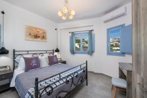 A bed or beds in a room at La Boheme Villas