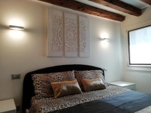 Giường trong phòng chung tại Cà Mercante di Spezie