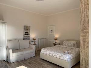 A bed or beds in a room at Don Giacchì Country House