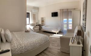 A bed or beds in a room at Don Giacchì Country House