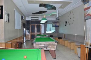 a billiard room with several pool tables in it at HOTEL SALIM in Casablanca