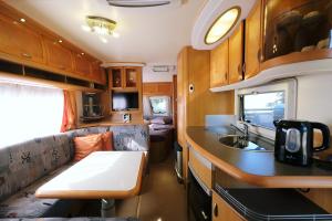 a kitchen and living room of an rv at Limnos Stone House in Kalliópi