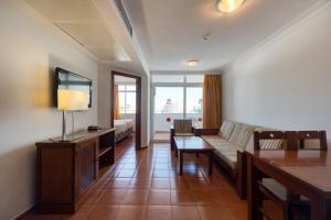 a living room with a couch and a table at TC Apartamentos Dorotea in Playa del Ingles