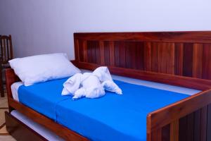 Säng eller sängar i ett rum på Pousada lagoa da Barra Taiba