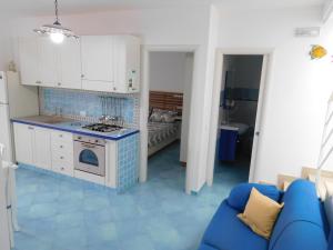 A kitchen or kitchenette at Residenza del Mare & SPA