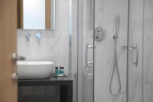 Vannituba majutusasutuses Athenaeum Smart Hotel