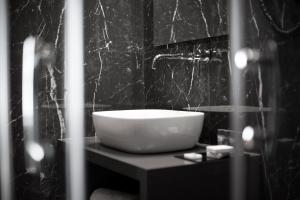 Vannituba majutusasutuses Athenaeum Smart Hotel