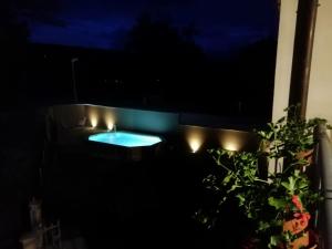 a night view of a swimming pool with lights at B&B da Morena in Gorfigliano