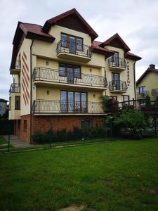 a large building with balconies on the side of it at Willa Panorama in Władysławowo