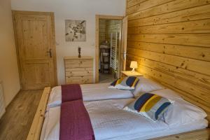 Letto o letti in una camera di Zruby Pod Chopkom