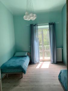 Uma cama ou camas num quarto em Scala Family Home