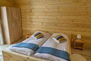Letto o letti in una camera di Zruby Pod Chopkom