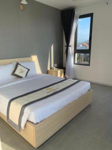 Postel nebo postele na pokoji v ubytování Summering Hotel