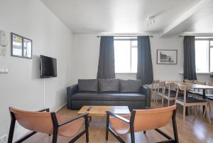 TV a/nebo společenská místnost v ubytování Stay Apartments Einholt