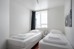 Postel nebo postele na pokoji v ubytování Stay Apartments Einholt