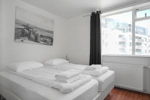 Postel nebo postele na pokoji v ubytování Stay Apartments Einholt