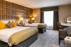Łóżko lub łóżka w pokoju w obiekcie Hotel Doolin