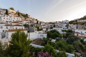 a view of a town with white houses at Hotel Miranda in Hydra
