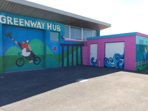 a building with a mural of a person riding a bike at Waterford Viking Hotel in Waterford