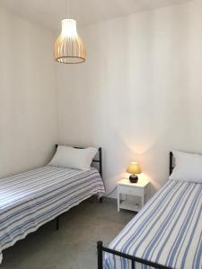 Voodi või voodid majutusasutuse Casa Vigna toas