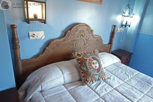 A bed or beds in a room at El Rincon de Piedra