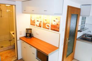 a kitchen with a counter with a coffee maker on it at Ferienwohnung Marienblick in Sipplingen