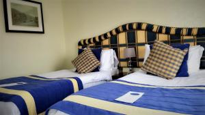 Postel nebo postele na pokoji v ubytování The George Hotel